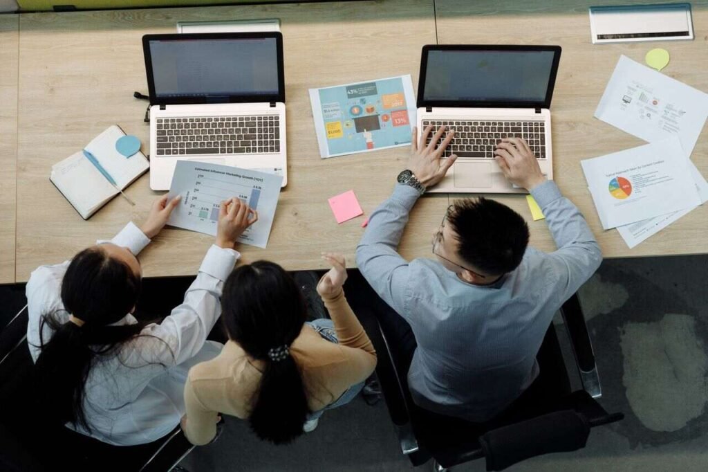 Students from different fields using AI laptops