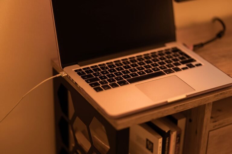 Laptop charger connected to a modern laptop for fast and efficient charging in 2026