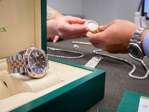 Customer trying on a luxury Swiss watch before purchase